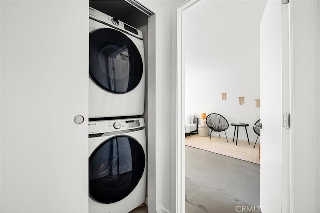 laundry area featuring stacked washer and dryer