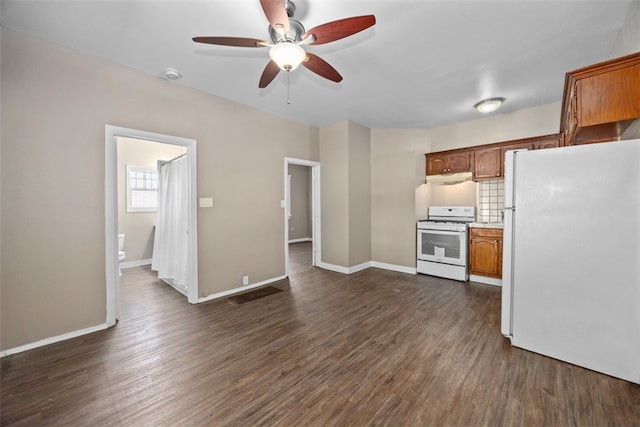 kitchen with white appliances, dark hardwood / wood-style floors, ceiling fan, and tasteful backsplash