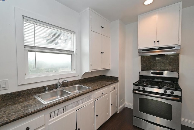 kitchen featuring white cabinetry, gas range, and sink