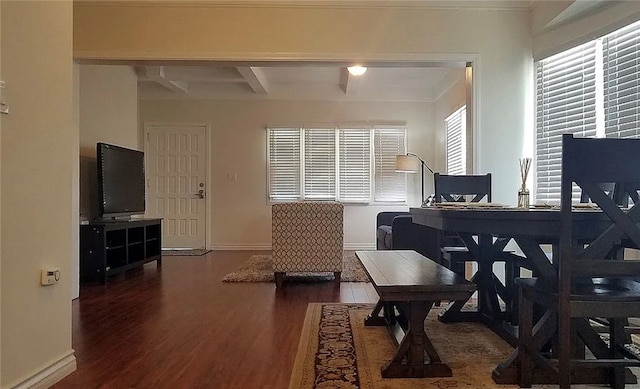 office area with beam ceiling and dark hardwood / wood-style flooring