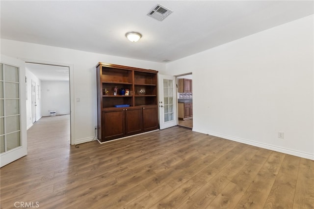 interior space featuring french doors and hardwood / wood-style floors