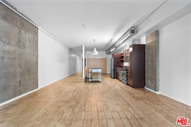 unfurnished living room with light hardwood / wood-style floors