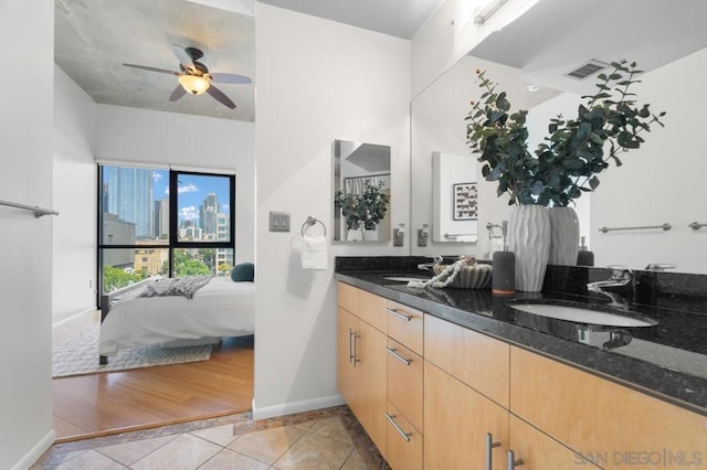 bathroom featuring ceiling fan, vanity, and tile patterned flooring