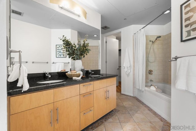 bathroom with vanity, shower / tub combo, and tile patterned flooring