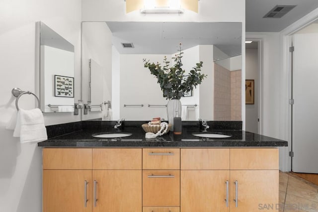 bathroom featuring vanity and tile patterned flooring