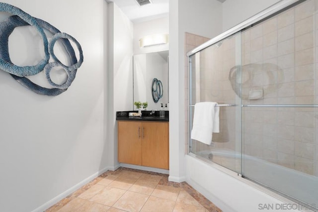 bathroom with vanity, tile patterned flooring, and shower / bath combination with glass door