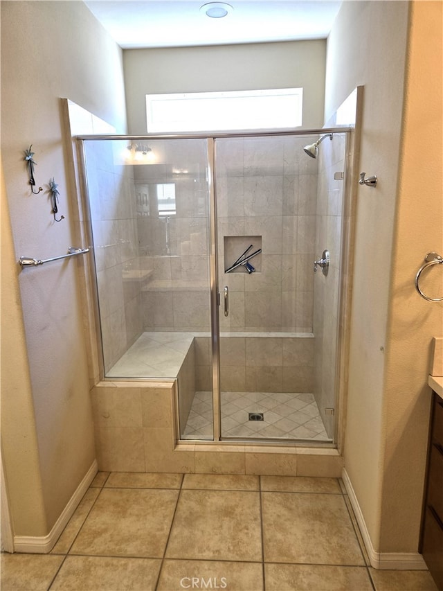 bathroom with vanity, tile patterned flooring, and an enclosed shower