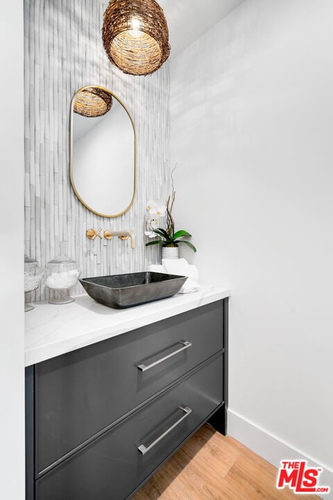 bathroom featuring hardwood / wood-style floors and vanity