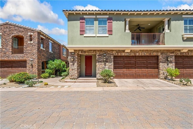 view of front of home featuring a balcony and a garage