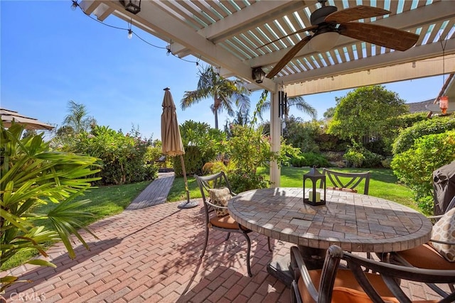 view of patio featuring ceiling fan and a pergola