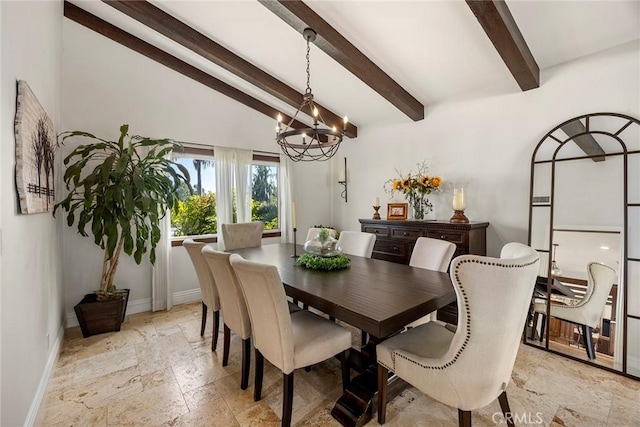 dining room with lofted ceiling with beams and an inviting chandelier