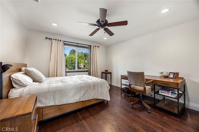 bedroom featuring ceiling fan and dark hardwood / wood-style floors