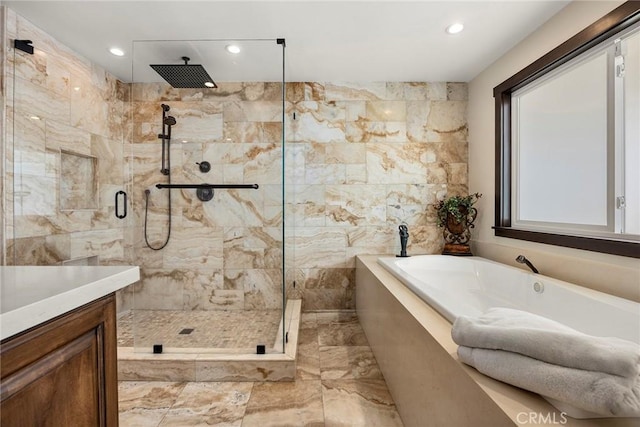 bathroom with separate shower and tub