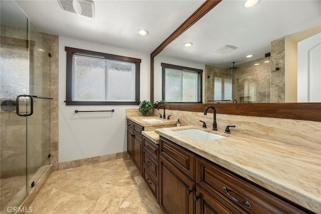 bathroom with vanity and an enclosed shower