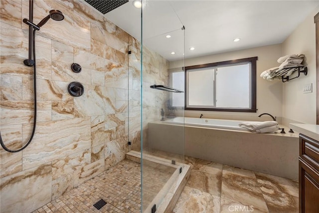 bathroom with shower with separate bathtub and vanity