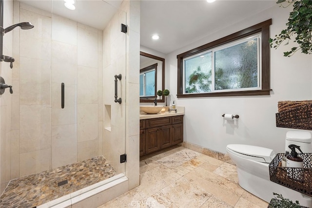 bathroom with vanity, toilet, and walk in shower