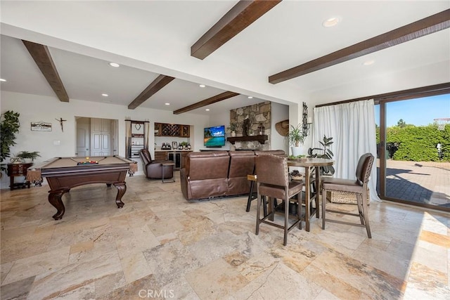 dining area with beamed ceiling and billiards