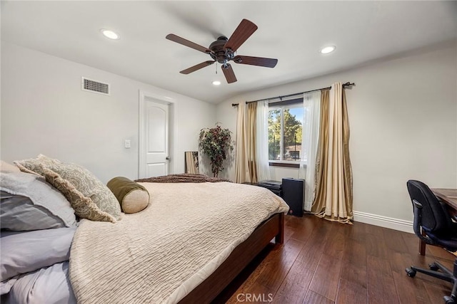 bedroom with ceiling fan and dark wood-type flooring