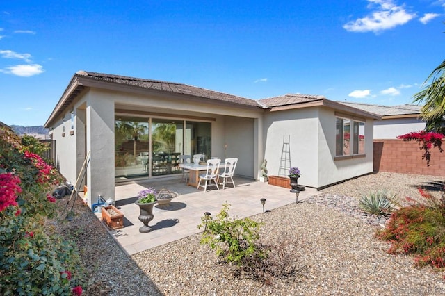 rear view of house featuring a patio