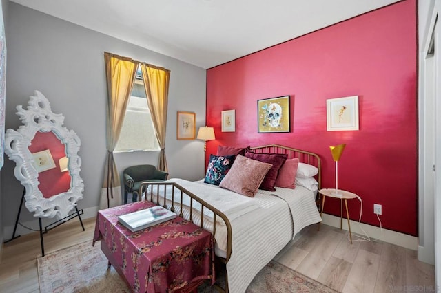 bedroom with light wood-type flooring