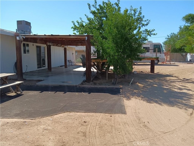 back of property with a patio