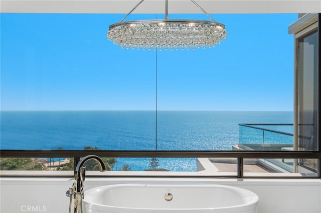 interior space with a water view and sink