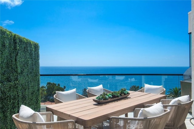 balcony featuring a water view