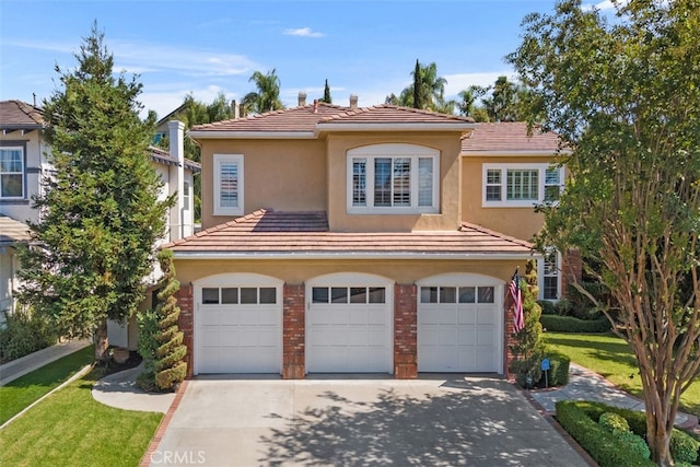 view of front of home featuring a front lawn and a garage