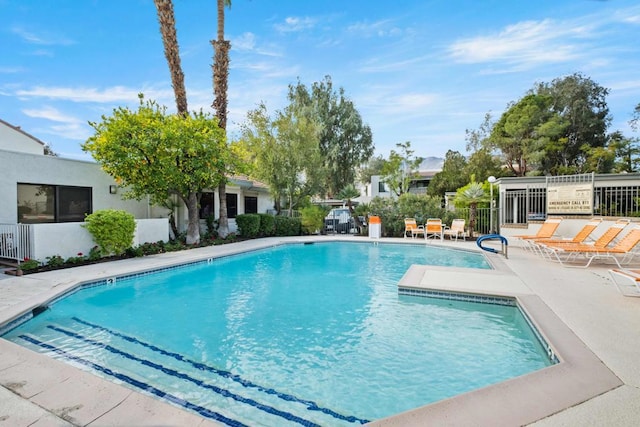 view of swimming pool featuring a patio