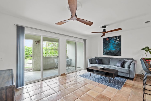 living room featuring ceiling fan and light tile patterned floors