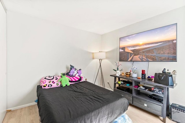 bedroom with light wood-type flooring