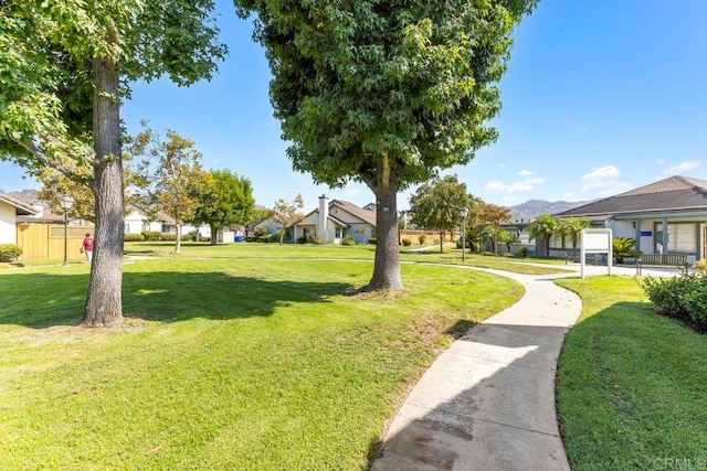 view of home's community with a lawn