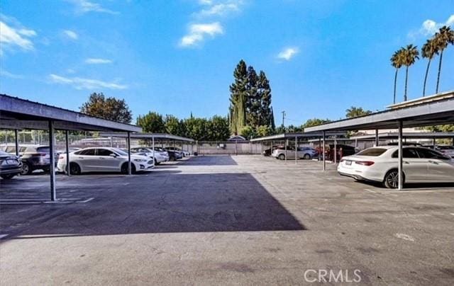 view of vehicle parking with a carport