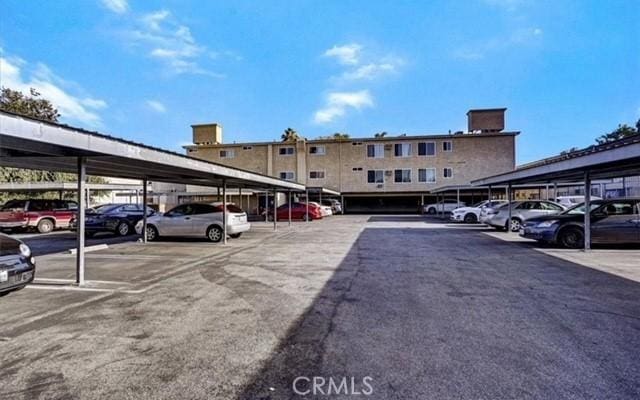 view of vehicle parking with a carport