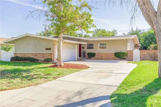 ranch-style home with a garage and a front yard