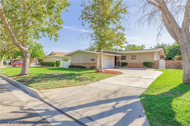 ranch-style house featuring a garage and a front yard