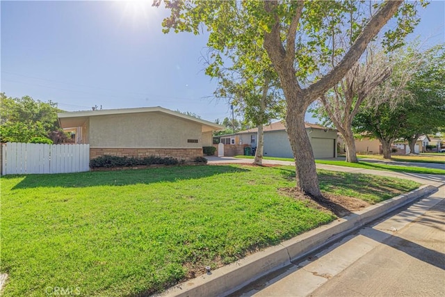 ranch-style house with a front lawn