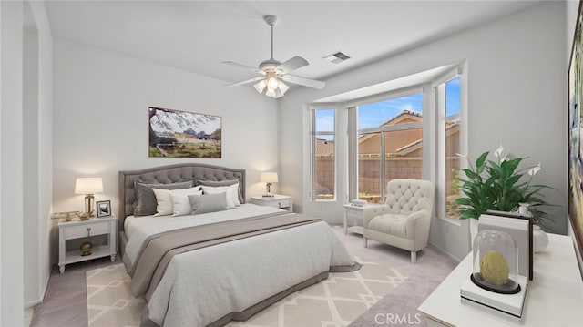 bedroom with ceiling fan and light carpet