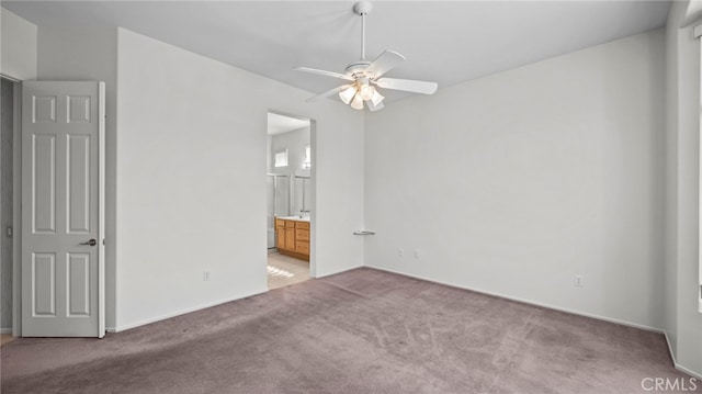 carpeted empty room featuring ceiling fan