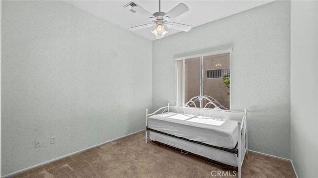 bedroom with ceiling fan and carpet floors