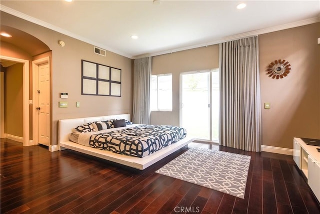 bedroom with access to exterior, dark hardwood / wood-style flooring, and crown molding