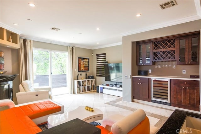 interior space with wine cooler and crown molding