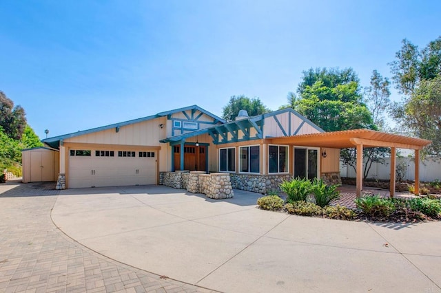 view of front of home with a garage and a carport