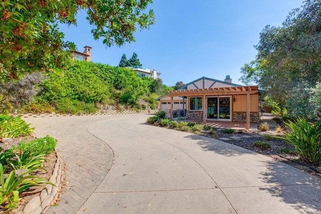 view of front of home featuring a pergola