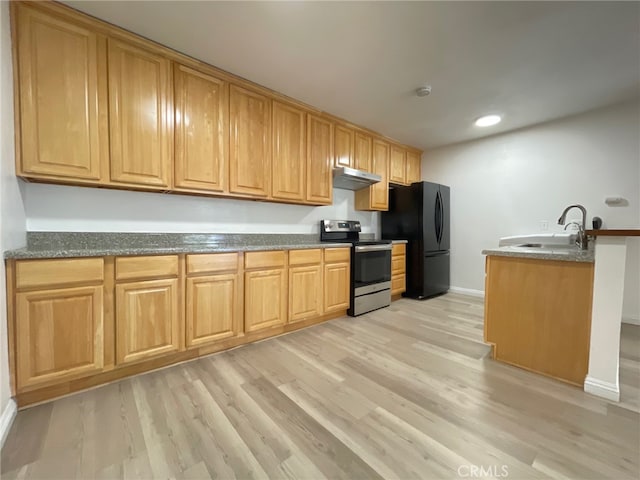 kitchen with light wood-type flooring, black fridge, sink, and stainless steel electric range oven