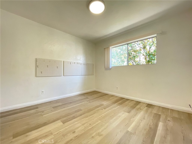 unfurnished room featuring light wood-type flooring