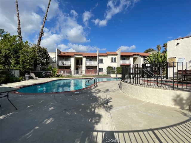 view of swimming pool with a patio