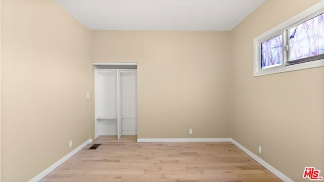 empty room with light wood-type flooring