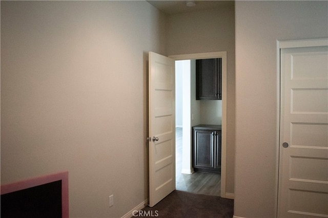 hallway featuring dark hardwood / wood-style flooring