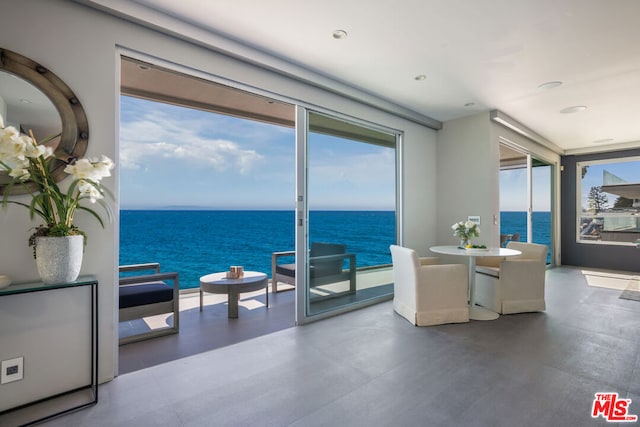 dining area featuring a water view